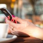 hands holding smartphone chatting 1853302